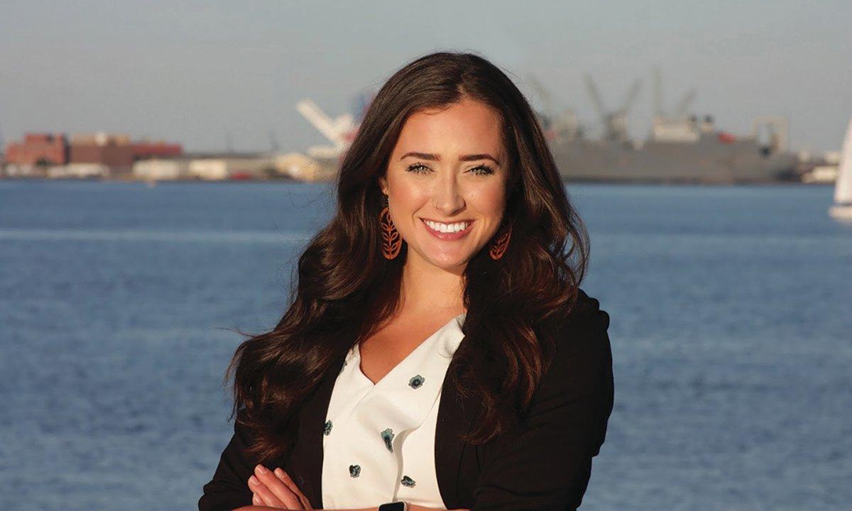 Smiling woman with water in background